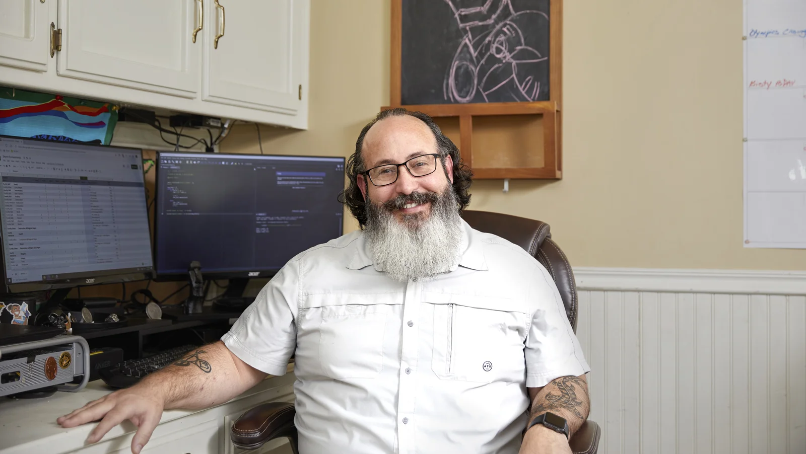 Veteran graduate of Google Career Certificate at his desk facing the camera