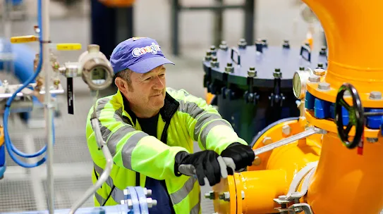 A man tightens a valve coupling in our Hamina, Finland data center to ensure we keep seawater from the Gulf of Finland in the appropriate cooling pipes.