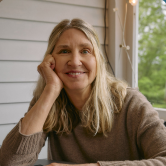 A photograph of Pam Davis, the owner of Our Green House