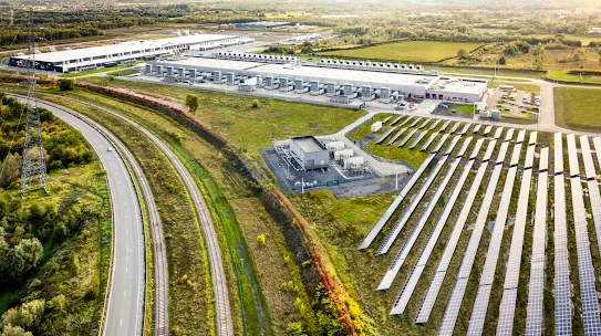 The sun shines over the Google solar field at our St. Ghislain, Belgium data center.